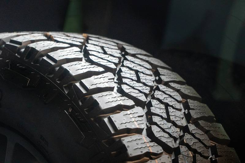 Close-up of a heavy tire tread.